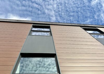 A wide view of building with the class door